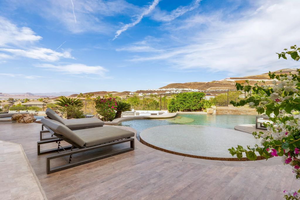 The Henderson Home, a newly renovated double-gated residence spotlights high ceilings, curved staircases, an open floor plan and an amazing outdoor area is now available for sale. This home located at 578 Lairmont Pl, Henderson, Nevada
