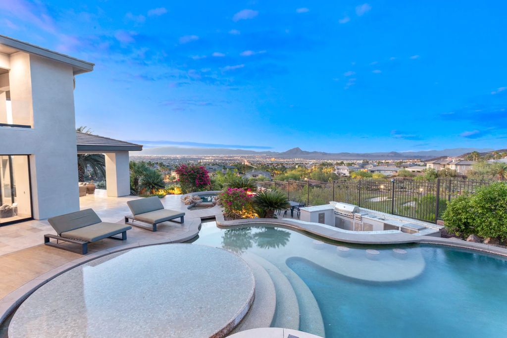 The Henderson Home, a newly renovated double-gated residence spotlights high ceilings, curved staircases, an open floor plan and an amazing outdoor area is now available for sale. This home located at 578 Lairmont Pl, Henderson, Nevada