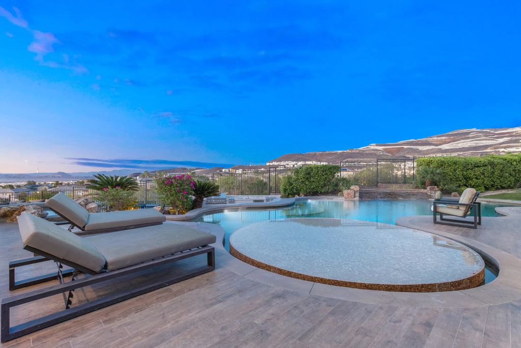The Henderson Home, a newly renovated double-gated residence spotlights high ceilings, curved staircases, an open floor plan and an amazing outdoor area is now available for sale. This home located at 578 Lairmont Pl, Henderson, Nevada