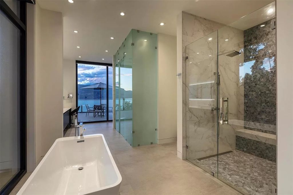 The Home in Kelowna offers unparalleled amenities, including stunning Japanese-inspired hidden garden, beach house, pool, and so much more, now available for sale. This home located at 6950 Lakeshore Rd, Kelowna, BC V1W 4J5, Canada