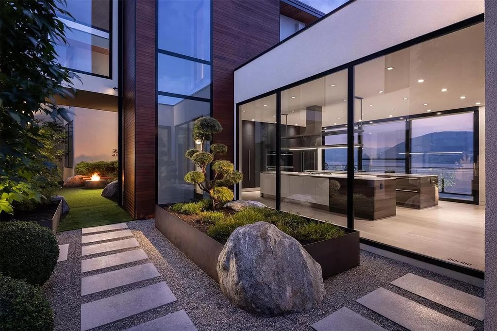 The Home in Kelowna offers unparalleled amenities, including stunning Japanese-inspired hidden garden, beach house, pool, and so much more, now available for sale. This home located at 6950 Lakeshore Rd, Kelowna, BC V1W 4J5, Canada