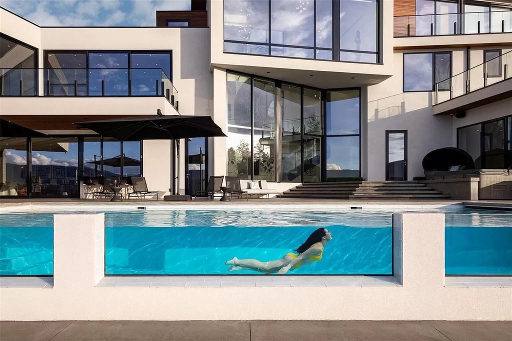 The Home in Kelowna offers unparalleled amenities, including stunning Japanese-inspired hidden garden, beach house, pool, and so much more, now available for sale. This home located at 6950 Lakeshore Rd, Kelowna, BC V1W 4J5, Canada
