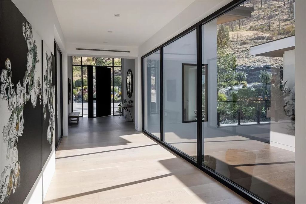 The Home in Kelowna offers unparalleled amenities, including stunning Japanese-inspired hidden garden, beach house, pool, and so much more, now available for sale. This home located at 6950 Lakeshore Rd, Kelowna, BC V1W 4J5, Canada