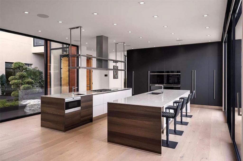 The Home in Kelowna offers unparalleled amenities, including stunning Japanese-inspired hidden garden, beach house, pool, and so much more, now available for sale. This home located at 6950 Lakeshore Rd, Kelowna, BC V1W 4J5, Canada