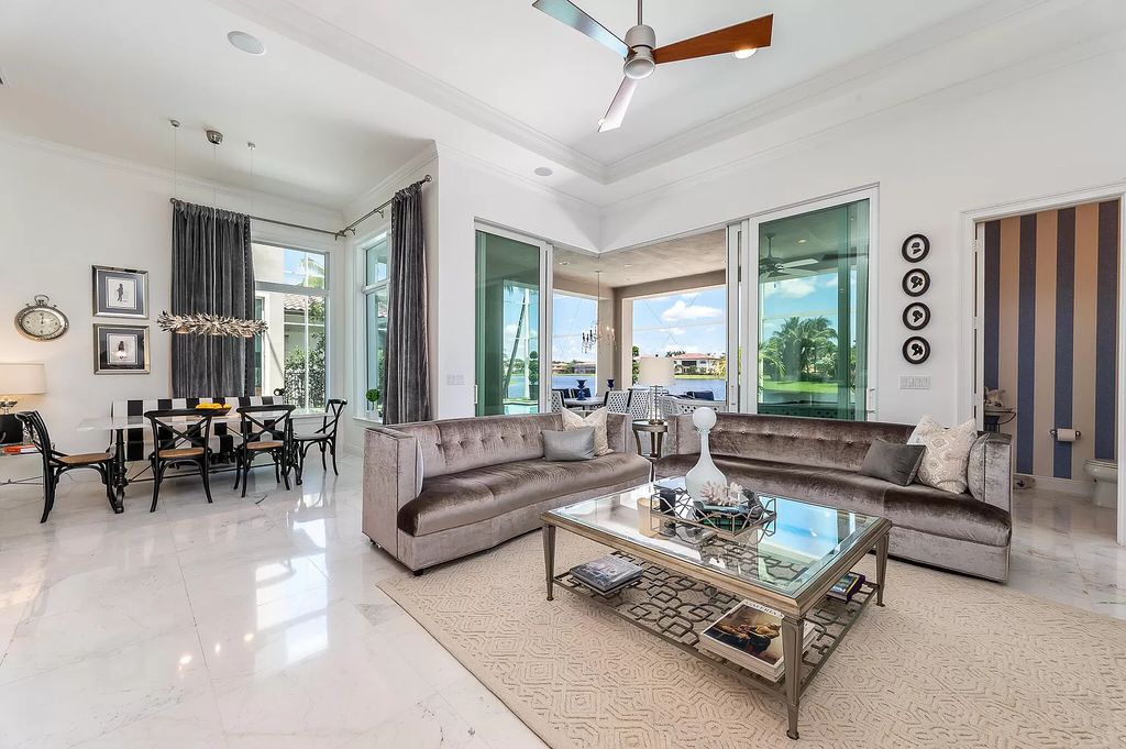 The Boca Raton Home, a smart residence is located on a premium lot overlooking the grand lake and features a breathtaking backyard is now available for sale. This home located at 9099 Redonda Dr, Boca Raton, Florida