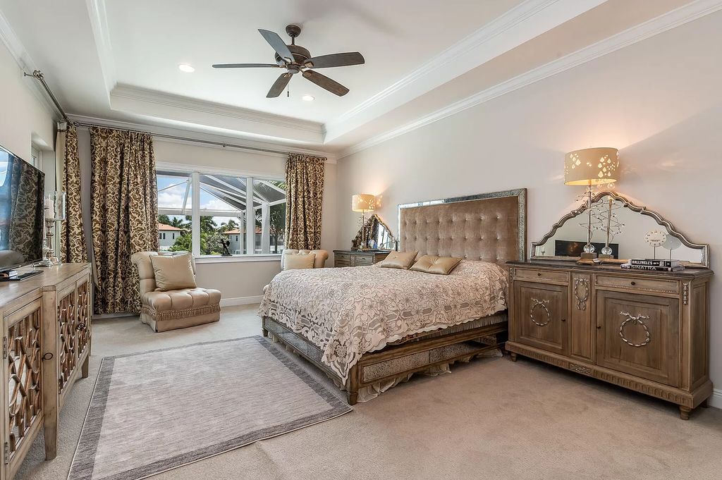 The Boca Raton Home, a smart residence is located on a premium lot overlooking the grand lake and features a breathtaking backyard is now available for sale. This home located at 9099 Redonda Dr, Boca Raton, Florida