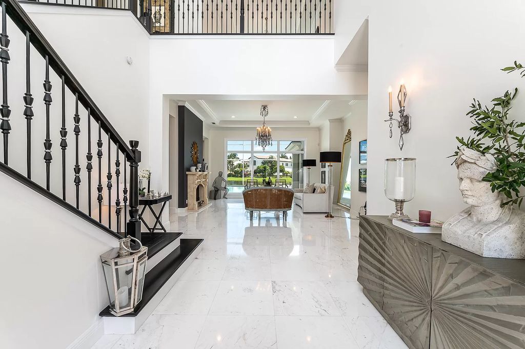 The Boca Raton Home, a smart residence is located on a premium lot overlooking the grand lake and features a breathtaking backyard is now available for sale. This home located at 9099 Redonda Dr, Boca Raton, Florida