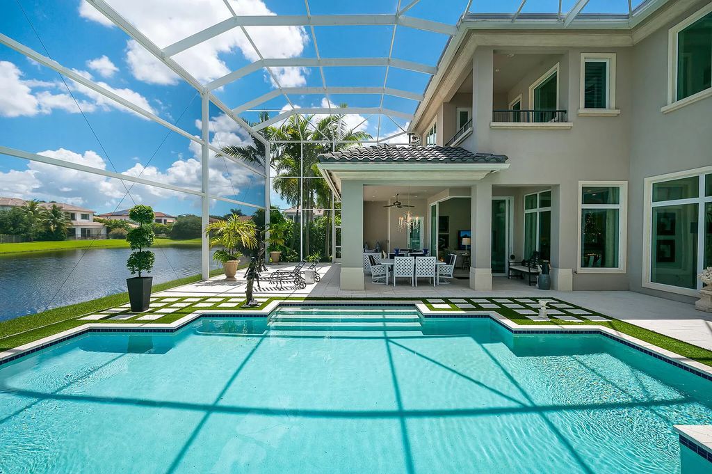 The Boca Raton Home, a smart residence is located on a premium lot overlooking the grand lake and features a breathtaking backyard is now available for sale. This home located at 9099 Redonda Dr, Boca Raton, Florida