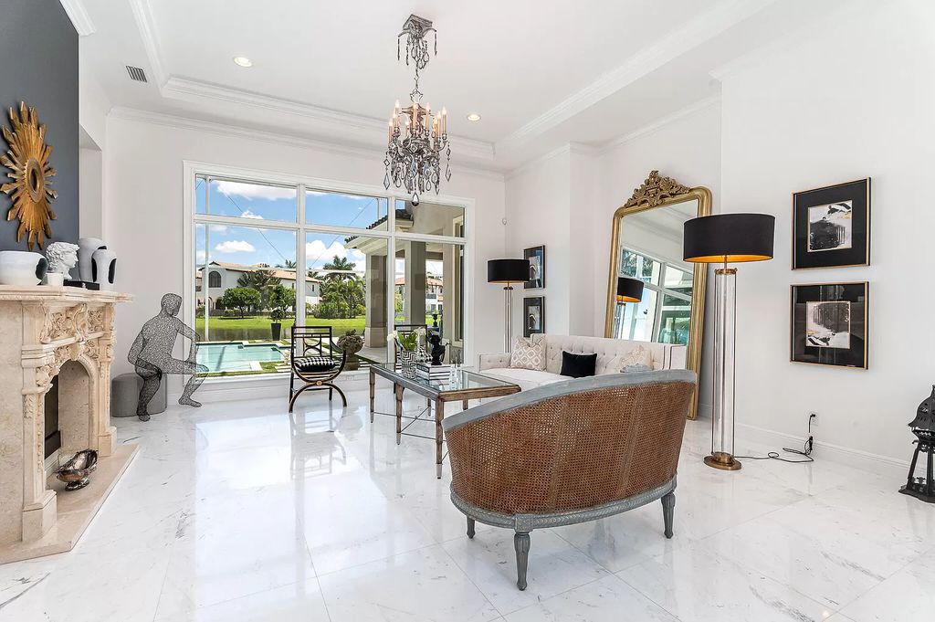 The Boca Raton Home, a smart residence is located on a premium lot overlooking the grand lake and features a breathtaking backyard is now available for sale. This home located at 9099 Redonda Dr, Boca Raton, Florida