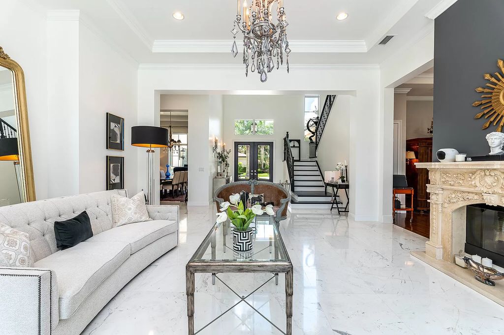 The Boca Raton Home, a smart residence is located on a premium lot overlooking the grand lake and features a breathtaking backyard is now available for sale. This home located at 9099 Redonda Dr, Boca Raton, Florida
