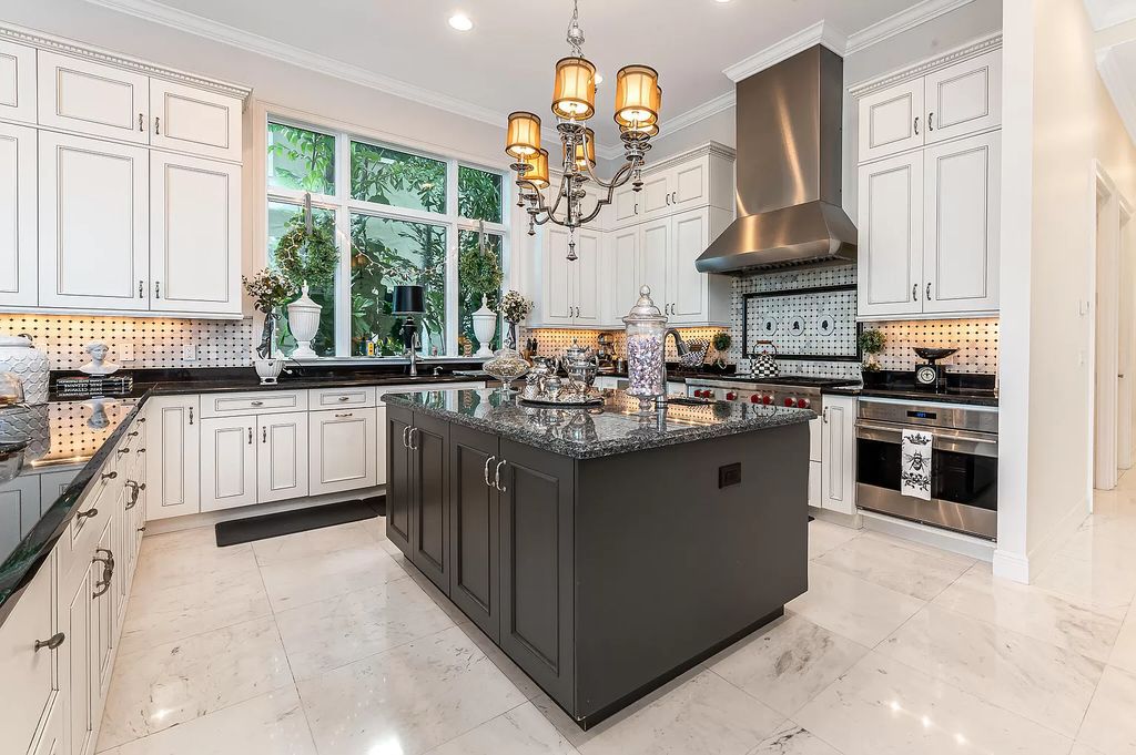 The Boca Raton Home, a smart residence is located on a premium lot overlooking the grand lake and features a breathtaking backyard is now available for sale. This home located at 9099 Redonda Dr, Boca Raton, Florida