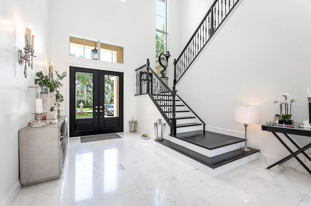 The Boca Raton Home, a smart residence is located on a premium lot overlooking the grand lake and features a breathtaking backyard is now available for sale. This home located at 9099 Redonda Dr, Boca Raton, Florida