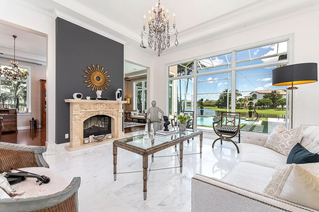 The Boca Raton Home, a smart residence is located on a premium lot overlooking the grand lake and features a breathtaking backyard is now available for sale. This home located at 9099 Redonda Dr, Boca Raton, Florida