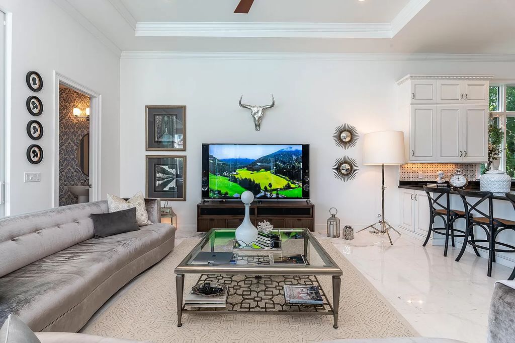 The Boca Raton Home, a smart residence is located on a premium lot overlooking the grand lake and features a breathtaking backyard is now available for sale. This home located at 9099 Redonda Dr, Boca Raton, Florida