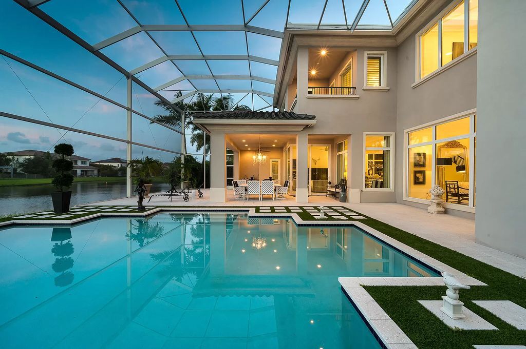 The Boca Raton Home, a smart residence is located on a premium lot overlooking the grand lake and features a breathtaking backyard is now available for sale. This home located at 9099 Redonda Dr, Boca Raton, Florida