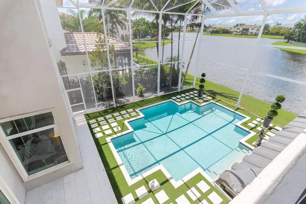 The Boca Raton Home, a smart residence is located on a premium lot overlooking the grand lake and features a breathtaking backyard is now available for sale. This home located at 9099 Redonda Dr, Boca Raton, Florida