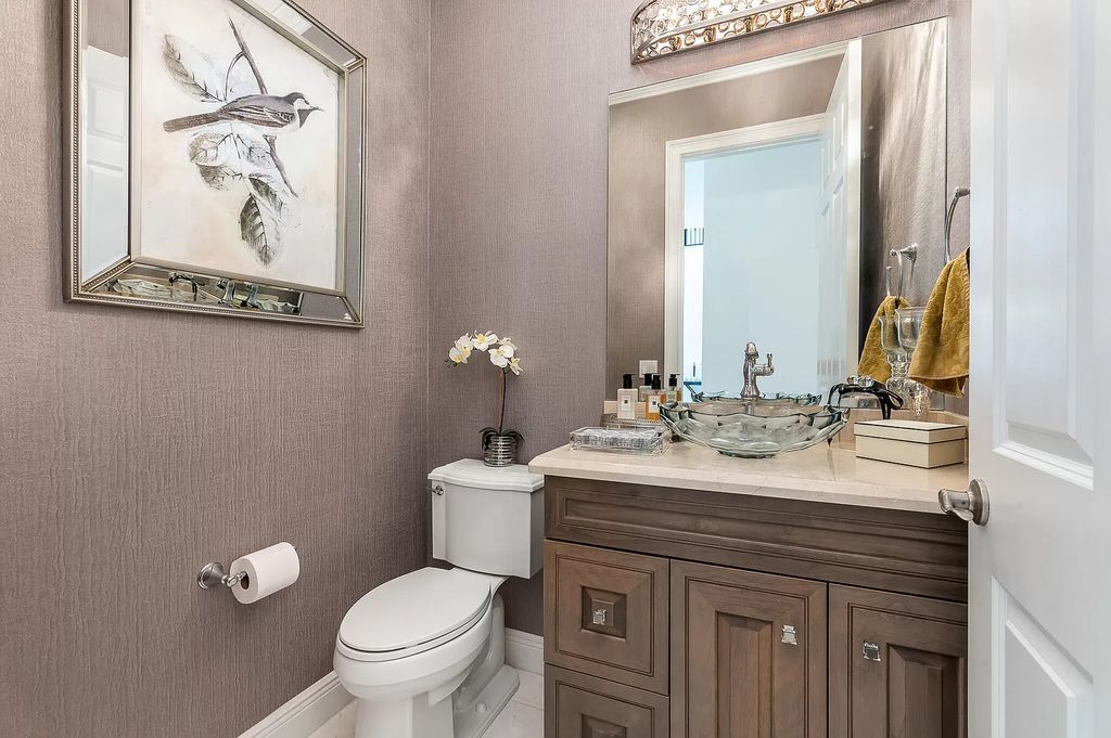 The Boca Raton Home, a smart residence is located on a premium lot overlooking the grand lake and features a breathtaking backyard is now available for sale. This home located at 9099 Redonda Dr, Boca Raton, Florida