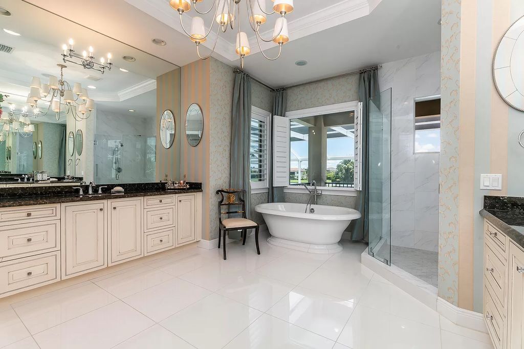 The Boca Raton Home, a smart residence is located on a premium lot overlooking the grand lake and features a breathtaking backyard is now available for sale. This home located at 9099 Redonda Dr, Boca Raton, Florida
