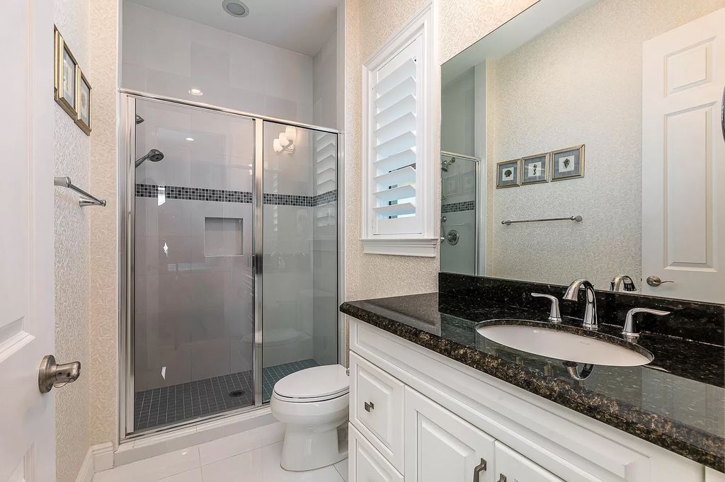 The Boca Raton Home, a smart residence is located on a premium lot overlooking the grand lake and features a breathtaking backyard is now available for sale. This home located at 9099 Redonda Dr, Boca Raton, Florida