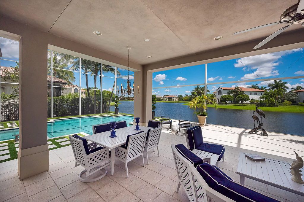 The Boca Raton Home, a smart residence is located on a premium lot overlooking the grand lake and features a breathtaking backyard is now available for sale. This home located at 9099 Redonda Dr, Boca Raton, Florida