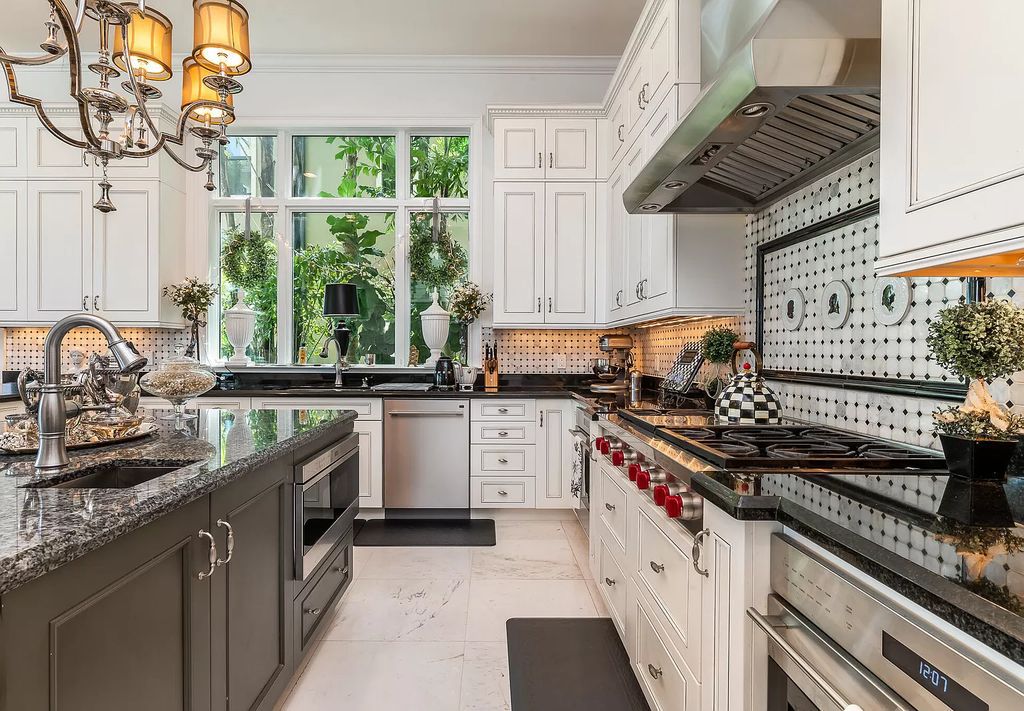 The Boca Raton Home, a smart residence is located on a premium lot overlooking the grand lake and features a breathtaking backyard is now available for sale. This home located at 9099 Redonda Dr, Boca Raton, Florida