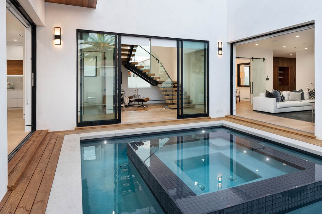 The Home in Venice is a newer construction home features an open floor plan, high ceilings and oversized windows that create a bright crisp ambiance now available for sale. This home located at 2319 Penmar Ave, Venice, California