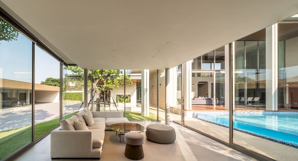 TT residence with a Central Glass fronted Swimming Pool by FLAT12x 16