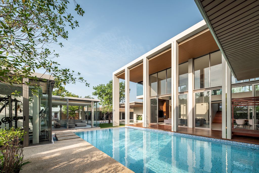 TT residence with a Central Glass fronted Swimming Pool by FLAT12x 18