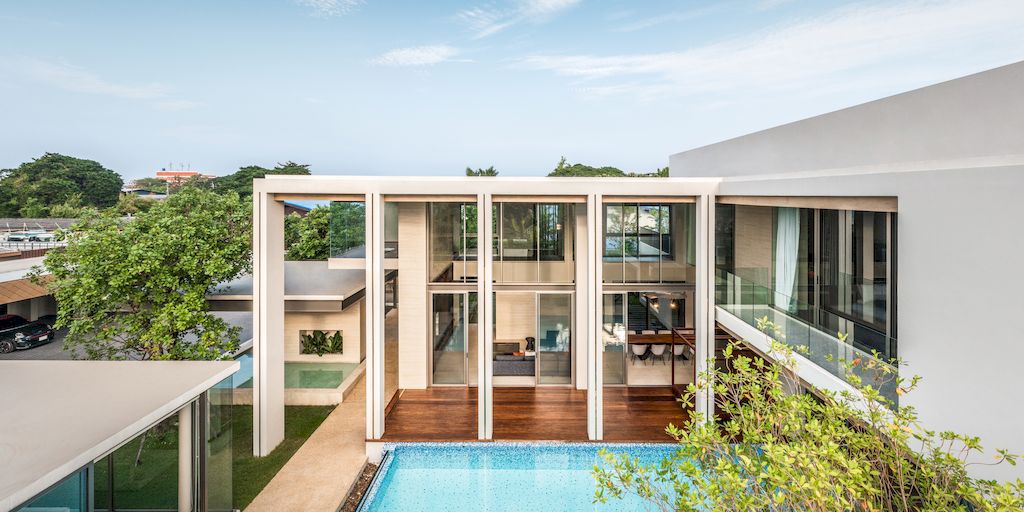 TT residence with a Central Glass fronted Swimming Pool by FLAT12x 20