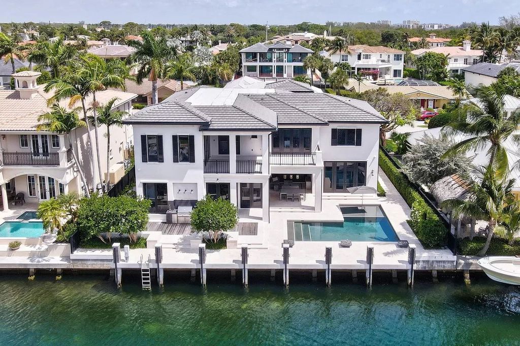 The Home in Boca Raton, a spectacularly custom crafted contemporary waterfront estate boasting exceptional indoor-outdoor living is now available for sale. This home located at 550 Golden Harbour Dr, Boca Raton, Florida