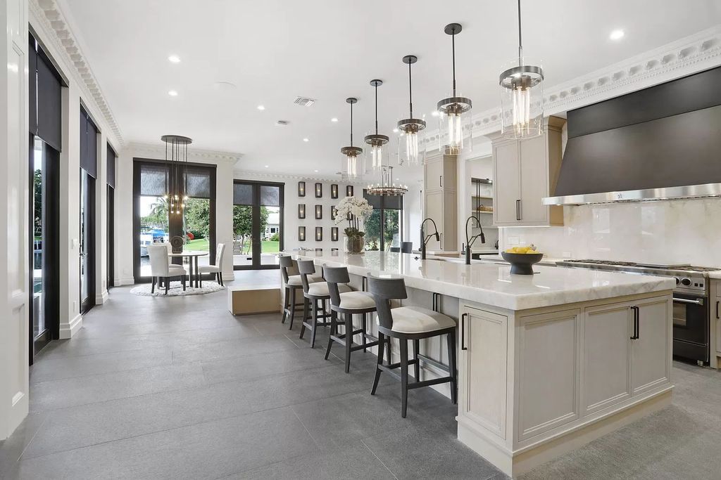 The Home in Boca Raton, a spectacularly custom crafted contemporary waterfront estate boasting exceptional indoor-outdoor living is now available for sale. This home located at 550 Golden Harbour Dr, Boca Raton, Florida