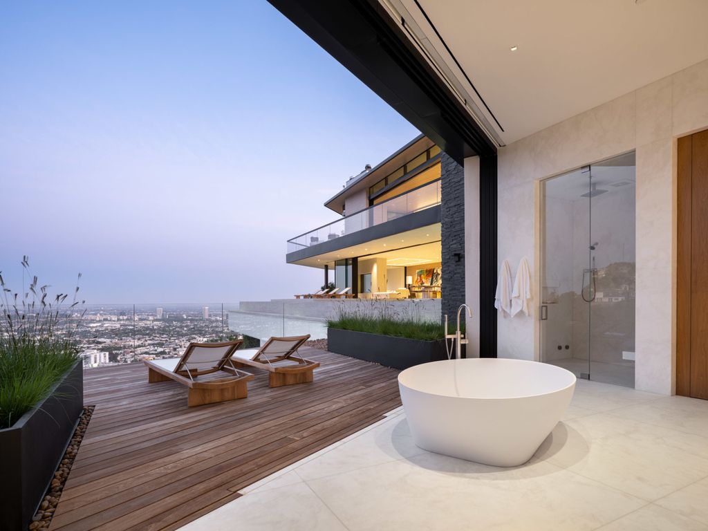The Home in Los Angeles is a brand new modern mansion designed by Vantage Design Group features the finest finishes, incredible volume, and jetliner views now available for sale. This home located at 11630 Moraga Ln, Los Angeles, California
