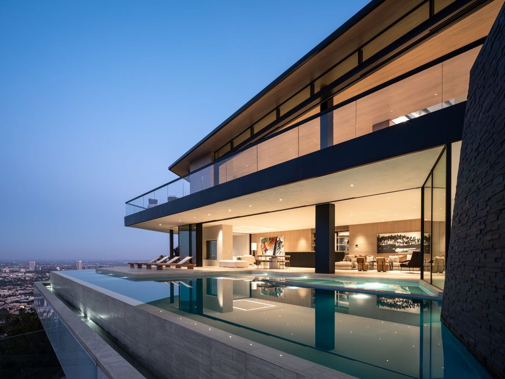 The Home in Los Angeles is a brand new modern mansion designed by Vantage Design Group features the finest finishes, incredible volume, and jetliner views now available for sale. This home located at 11630 Moraga Ln, Los Angeles, California