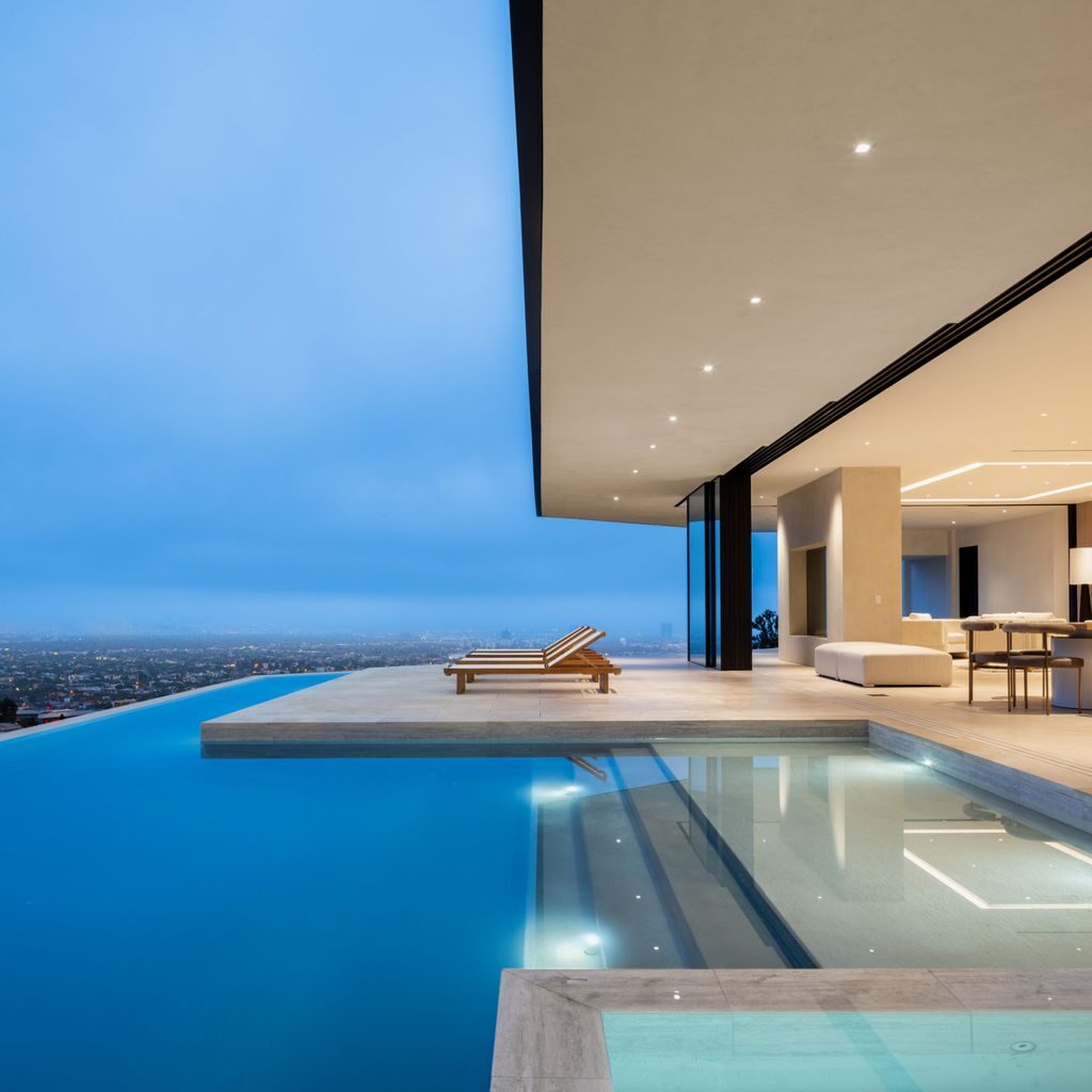The Home in Los Angeles is a brand new modern mansion designed by Vantage Design Group features the finest finishes, incredible volume, and jetliner views now available for sale. This home located at 11630 Moraga Ln, Los Angeles, California