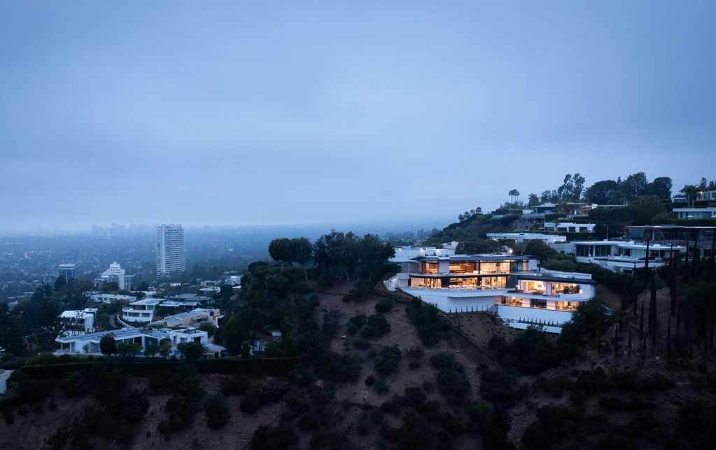 The Home in Los Angeles is a brand new modern mansion designed by Vantage Design Group features the finest finishes, incredible volume, and jetliner views now available for sale. This home located at 11630 Moraga Ln, Los Angeles, California