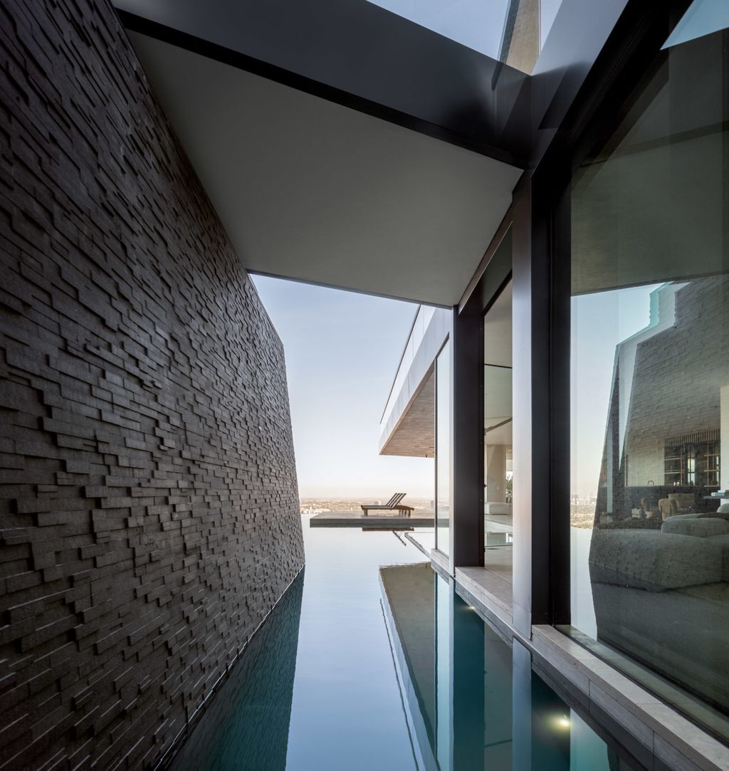 The Home in Los Angeles is a brand new modern mansion designed by Vantage Design Group features the finest finishes, incredible volume, and jetliner views now available for sale. This home located at 11630 Moraga Ln, Los Angeles, California