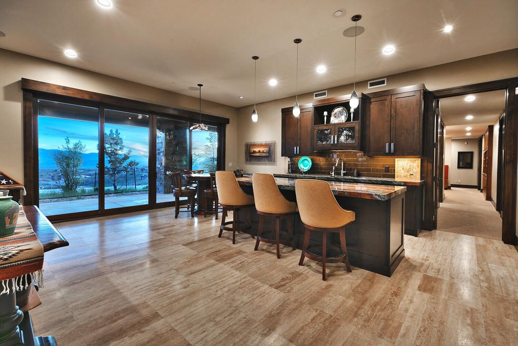 The Home in Park City, a spectacular mountain view residence designed by 4C Design Group and meticulously built by Douglas Knight perfect for parties and family gatherings is now available for sale. This home located at 9021 N Promontory Summit Dr, Park City, Utah