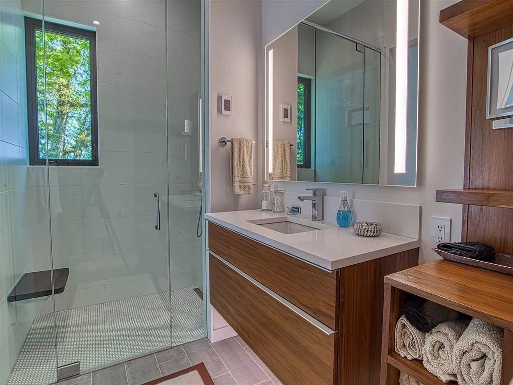 The Home in Suttons Bay is built by Easling Construction and designed by Ray Kendra & ReDesign Interiors, now available for sale. This home located at 3693 S Bay Ridge Ln, Suttons Bay, Michigan