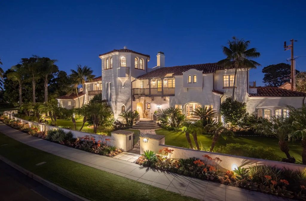 The Estate in Coronado, a historical landmark sits on a palm-lined promenade offering state-of-the-art amenities for optimal luxury living space, 100-year-old rustic olive trees, three fountains, a putting green, secret garden is now available for sale. This home located at 1127 F Ave, Coronado, California