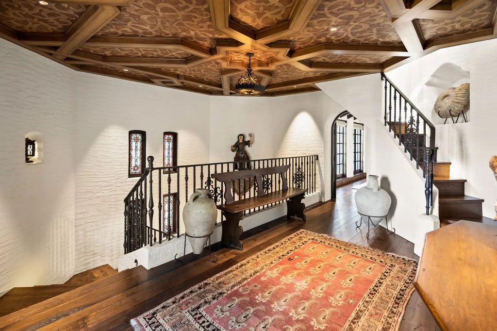 The Estate in Coronado, a historical landmark sits on a palm-lined promenade offering state-of-the-art amenities for optimal luxury living space, 100-year-old rustic olive trees, three fountains, a putting green, secret garden is now available for sale. This home located at 1127 F Ave, Coronado, California