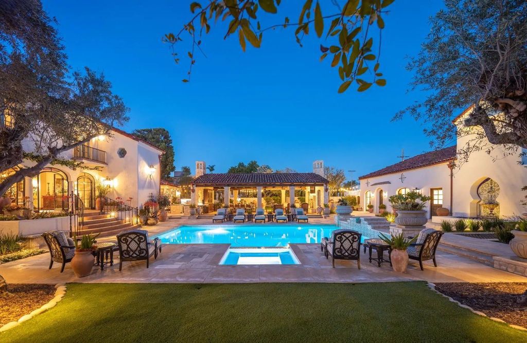 The Estate in Coronado, a historical landmark sits on a palm-lined promenade offering state-of-the-art amenities for optimal luxury living space, 100-year-old rustic olive trees, three fountains, a putting green, secret garden is now available for sale. This home located at 1127 F Ave, Coronado, California