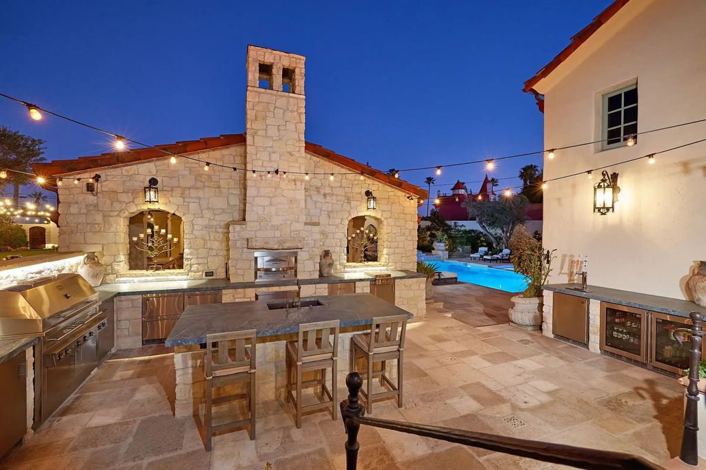 The Estate in Coronado, a historical landmark sits on a palm-lined promenade offering state-of-the-art amenities for optimal luxury living space, 100-year-old rustic olive trees, three fountains, a putting green, secret garden is now available for sale. This home located at 1127 F Ave, Coronado, California