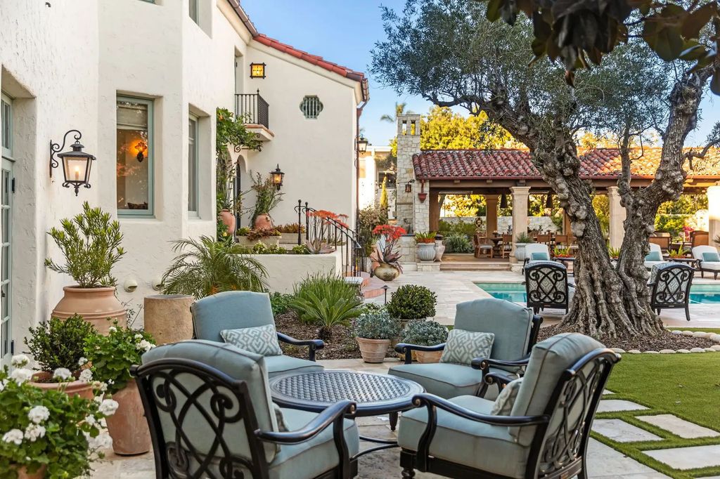 The Estate in Coronado, a historical landmark sits on a palm-lined promenade offering state-of-the-art amenities for optimal luxury living space, 100-year-old rustic olive trees, three fountains, a putting green, secret garden is now available for sale. This home located at 1127 F Ave, Coronado, California