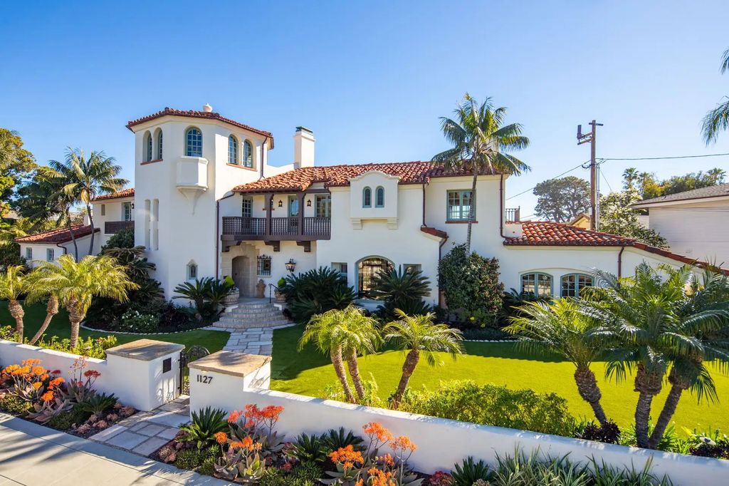 The Estate in Coronado, a historical landmark sits on a palm-lined promenade offering state-of-the-art amenities for optimal luxury living space, 100-year-old rustic olive trees, three fountains, a putting green, secret garden is now available for sale. This home located at 1127 F Ave, Coronado, California