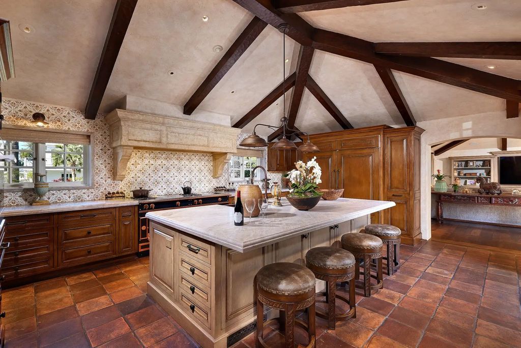 The Estate in Coronado, a historical landmark sits on a palm-lined promenade offering state-of-the-art amenities for optimal luxury living space, 100-year-old rustic olive trees, three fountains, a putting green, secret garden is now available for sale. This home located at 1127 F Ave, Coronado, California
