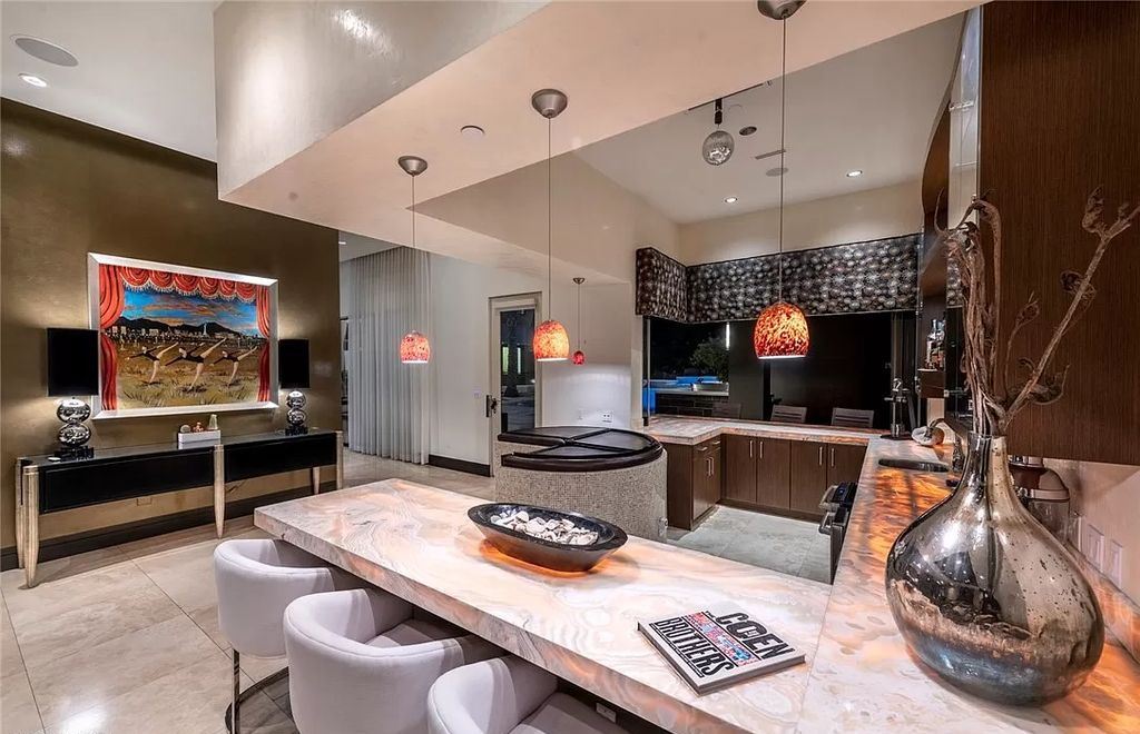 The Home in Henderson, a luxurious custom estate located inside prestigious McDonald’s Highlands with stunning entertainers delight backyard is now available for sale. This home located at 1465 Macdonald Ranch Dr, Henderson, Nevada