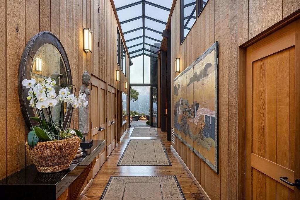 The Home in Carmel Valley, a modern compound designed by David Allen Smith with organic materials throughout, massive glass windows, and a voluminous interior is now available for sale. This home located at 49 Encina Dr, Carmel Valley, California