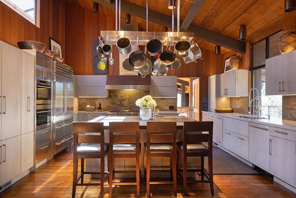 The Home in Carmel Valley, a modern compound designed by David Allen Smith with organic materials throughout, massive glass windows, and a voluminous interior is now available for sale. This home located at 49 Encina Dr, Carmel Valley, California