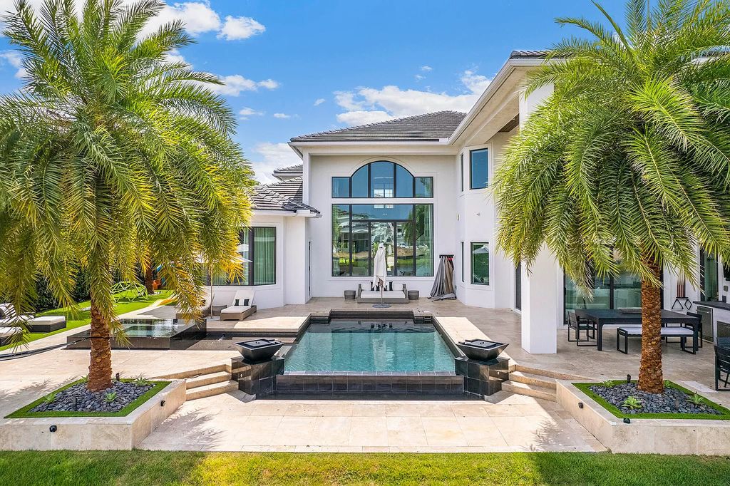 The Home in Boca Raton, a an impressive two-story residence masterfully designed for luxurious living and gracious entertaining on an oversized waterfront lot within the highly desirable community of Royal Palm Polo is now available for sale. This home located at 7305 NW 27th Ave, Boca Raton, Florida
