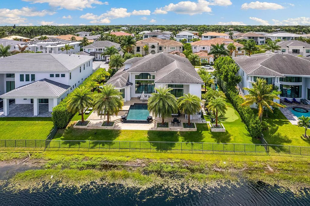 The Home in Boca Raton, a an impressive two-story residence masterfully designed for luxurious living and gracious entertaining on an oversized waterfront lot within the highly desirable community of Royal Palm Polo is now available for sale. This home located at 7305 NW 27th Ave, Boca Raton, Florida